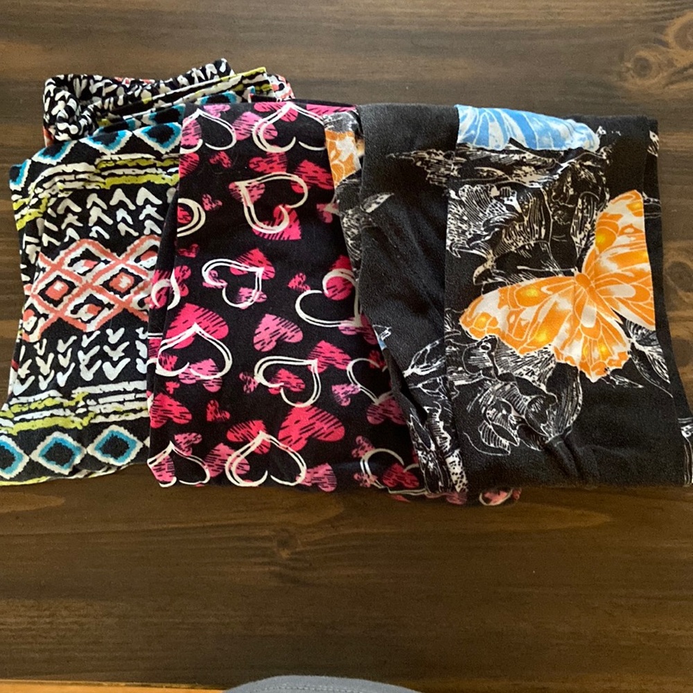 Bundle of 3 leggings by various brands. All 3 pairs are OS